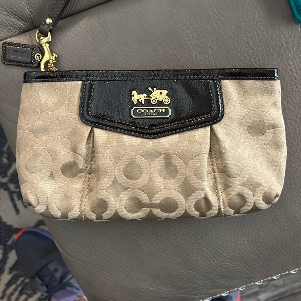 Coach cream and black large wristlet